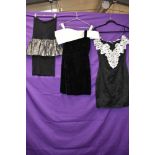 Three 1980s evening dresses,including off shoulder dress in black velvet,smaller sizes.
