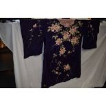 A purple silk kimono dressing gown having extensive floral embroidery,around 1920s-40s,a couple of