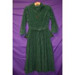 A vintage 1950s Peggy page dress in green and black checked corduroy with belt and contrasting