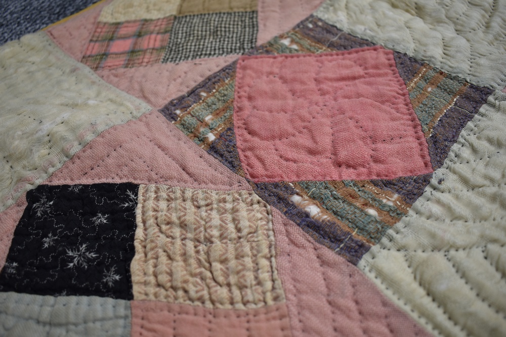 A large Victorian patchwork quilt, using various wool and wool blend fabrics, around a double in - Image 2 of 5