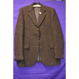 A vintage Harris tweed jacket in brown tones around late 60s/70s, pocket to sides and one to