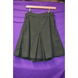 A pair of bottle green 1940s culottes/shorts, pleats to sides and button fastening to each.