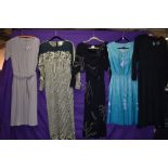 A selection of vintage 1970s and 80s maxi dresses and sun dresses.