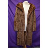 A vintage fur coat,thought to be ermine,having wide collar and Capstick and Hamer,Morecambe and