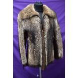 A ladies vintage fox fur jacket having leather panels to sides and sleeves,pockets to sides and