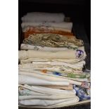 A large collection of vintage table linen, a lot having bright embroidery and some with crotchet