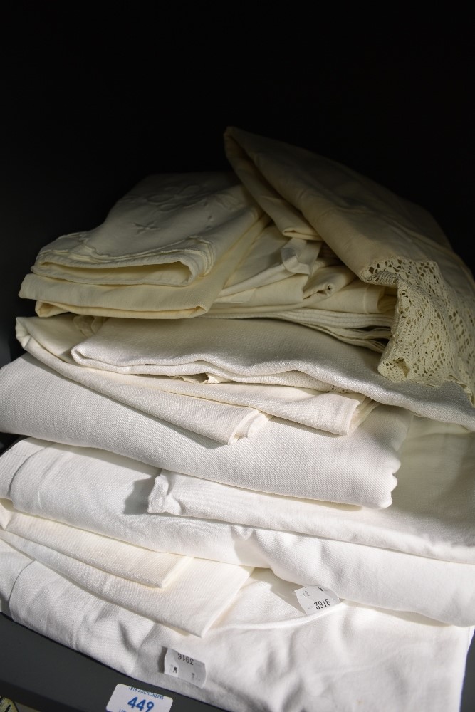 A good quantity of vintage bed linen and huckaback towels,including embroidered pillow cases and