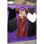 Four 1980s statement evening dresses amongst which is a full length black acetate dress with red