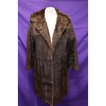 A vintage fur coat,thought to be ermine,having wide collar and Bainbridge and co, Newcastle label.