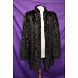 A mid length vintage black mink coat.