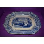 A large Blue and white platter having transfer pattern of classical scene to centre, marked A shaw