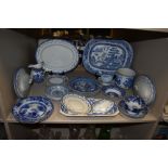 A selection of blue and white wear ceramics including Spode bowls and Cauldon cake plates