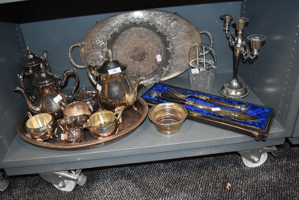 A selection of plated ware and similar including ornate boxed fish servers,tray, candle stick holder