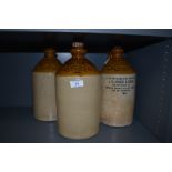 Three earthenware advertising bottles, of Bolton,Accrington, Blackpool and similar areas.