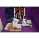 A signed nude photograph of Pamela Anderson with authenticity certificate,Julie Newmar signed