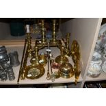 A selection of fine antique and later brass fire side items including 2 candle stick pairs fire dogs