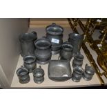 A selection of pewter tavern or pub tankards some bearing touch marks
