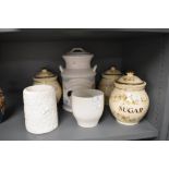 A collection of ceramics including kitchen jars and more.