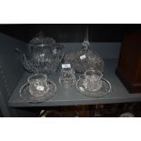 A selection of clear cut crystal glass wares including tea cups and saucers