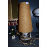 A vintage studio pottery table lamp with conical shade.