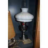 A 'famos' incandescent oil lamp with original instruction manual.