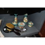 A ceramic dressing table set and similar ebony brush and mirror set