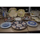 A selection of ceramic display plates including two Japanese Imari plates and Copeland Spode stand