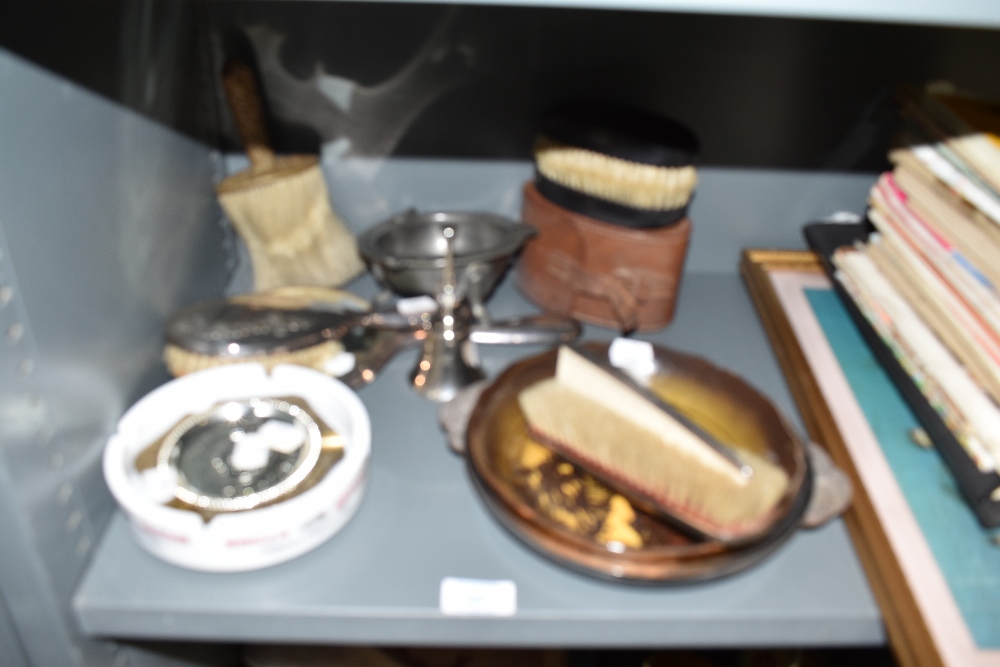 A selection of shoe shine items and trinket dishes including Stella Artois ashtray