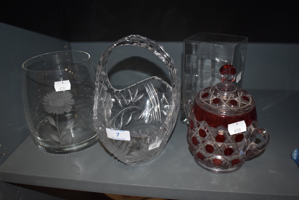 Four pieces of glass,including etched vase,basket and rectangular vase,also a coloured lidded pot.