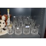 A selection of moulded drinks glasses,including wine glasses and tumblers.