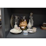 A selection of ceramics including Nao figurine Royal Doulton Robin hood jug and more.