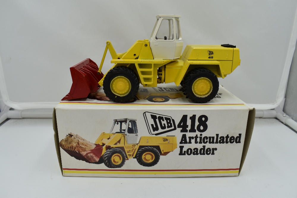 A 1:35 scale NZG Modelle diecast, JCB Articulated Loader 418 in original box 142