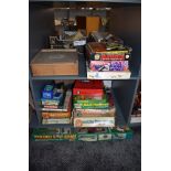 Two shelves of 1970's and later games and toys including Mouse Trap, Cluedo, Frustration,
