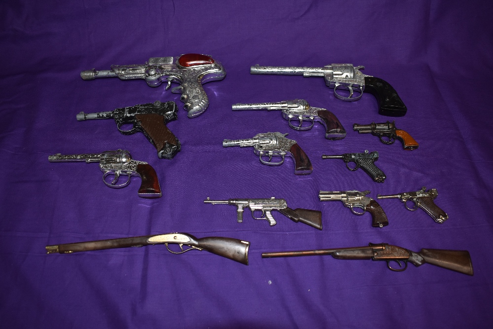 A selection of 1960's and later Toy Cap Guns BCM style Space Outlaw, Crescent Bronco, Lone Star Cody