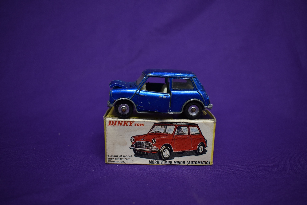 A Dinky diecast, Morris Mini-Minor in metallic blue with white interior, boxed 183 and a Lone Star