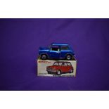 A Dinky diecast, Morris Mini-Minor in metallic blue with white interior, boxed 183 and a Lone Star