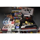 A shelf of modern toys including John Lewis Desktop Train Set, Marks & Spencer RC Mini Cooper S