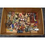 A box of Britains, Corgi and similar playworn diecast farm vehicles and machinery, wild west,