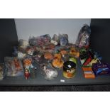A shelf of modern toys and collectables including 1997 Mcdonalds toys, most in packets 1981 Ideal