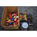 A selection of 1970/80's Lego including figures, a wooden block set, a Tomy 1979 Missile Strike