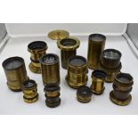 A selection of twelve brass lenses including 8 inch, Optimus etc