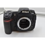 A Nikon D300 camera body in original box with manual