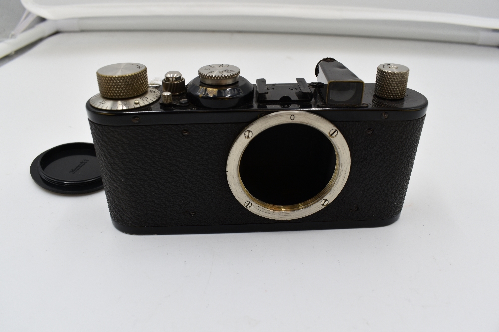 A Leica 1E camera body in leather case Circa 1932. Serial No 104542