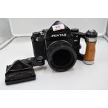 A Pentax 6X7 camera body. Serial No 4138372