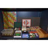 A selection of travel and table top childrens board games including Monopoly and Snakes and ladders