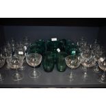 A selection of clear cut and crystal glass wares including star etched cocktail glasses and