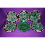 A set of five antique Majolica styled plates having naturalistic leave design in fair to good