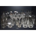 A selection of clear cut and crystal glass wares including wine and cocktail