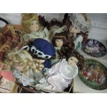 A box full of collectable dolls.