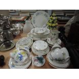 An assortment of ceramics including cups and saucers, platters,serving bowls and more.